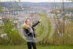 Woman in her forties standing on a mountain