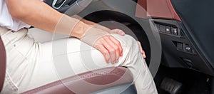 Woman with her knee sprain while driving car long time, Patellofemoral Pain Syndrome, osteoarthritis, arthritis, rheumatism and