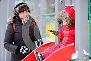 Woman and her little grandson at the playground