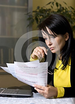 Woman and her monthly bills