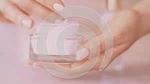 Woman and her morning skincare routine, female hand applying moisturizing cream or body lotion for healthy skin, organic