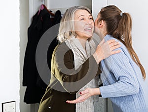 Woman and her mother embracing