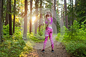 Woman during her run through woods
