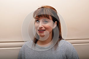 Woman in her thirties smiling portrait brunette confident