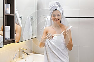 Woman during her daily tooth brushing routine