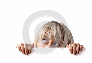 Woman hiding behind blank white board photo