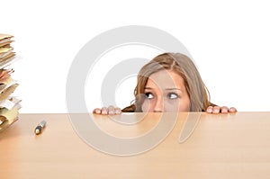 Woman hiding behind the desk