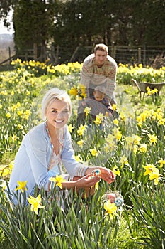 Woman Hiding Decorated Easter Eggs