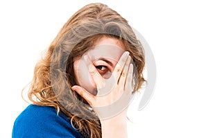 Woman hiding face laughing timid