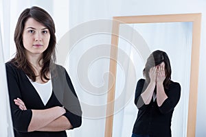 Woman hiding her bad mood photo