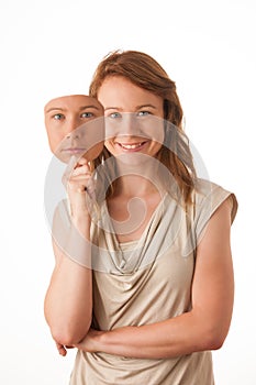 Woman hiding under the happy mask.