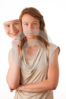 Woman hiding under the happy mask.