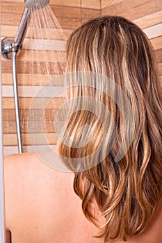 Woman with highlighted hair in shower