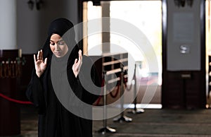 Woman in Hijab Sitting in Mosque and Praying