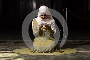 Woman in Hijab Sitting in Mosque and Praying