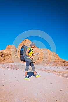 Woman Hiker with backpack and GPS