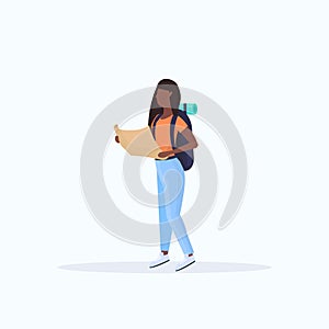 Woman hiker with backpack holding travel map african american girl planning the route hiking concept traveler on hike