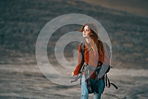 woman hiker with backpack travel mountains fresh air landscape