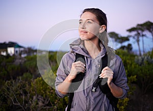 Woman, hiker and backpacking in nature travel for sightseeing or adventure in the outdoors. Happy female tourist