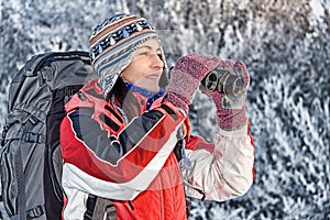 Woman hiker with binoculars