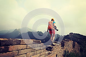 Woman hiker with camera on great wall