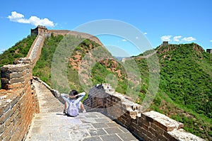 woman hiker with cross arms on Great Wall