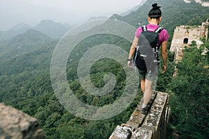 Woman hiker enjoy the view on the top of great wall