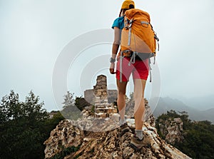 Woman hiker enjoy the view on the top of great wall