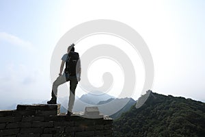 Woman hiker enjoy the view on the top of great wall