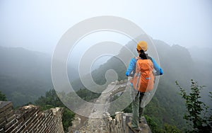 Woman hiker enjoy the view on the top of great wall