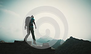 Woman hiker enjoy the view on the top of great wall