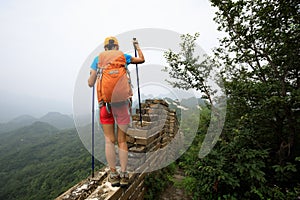 Woman hiker hiking on great wall