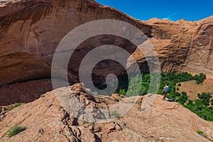 Woman Hiker at Jacob Hamblin Arch Coyote Gulch photo