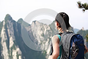 Woman hiker mountain peak