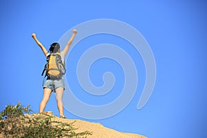 Woman hiker mountain peak