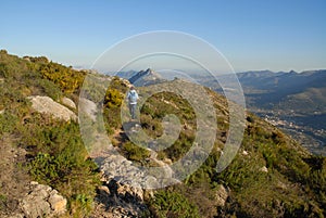 Woman hiker a mountain track, Spain photo