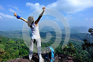 Woman hiker open arms