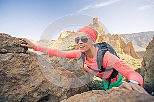 Woman hiker reached mountain top, backpacker adventure photo