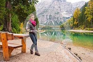 Woman hiker resting at picnic table on Lake Bries photo