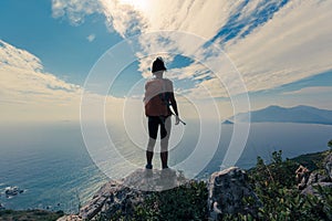 woman hiker standing on mountain peak