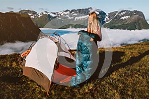 Woman hiker with tent camping gear morning in mountains active travel vacations outdoor, traveler girl hiking