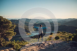 Woman hiker on a top of a mountain