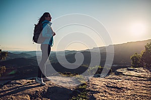 Woman hiker on a top of a mountain