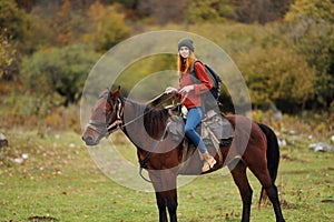 woman hiker travel mountains nature riding horse landscape