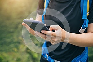 Woman hiker using smartphone