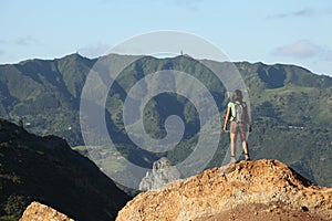 Woman hiker viewing central peaks on St Helena