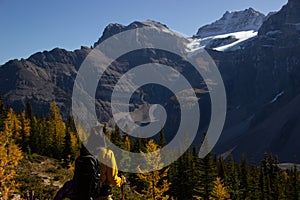 Woman hiker walking through the Rocky Mountains of Canada