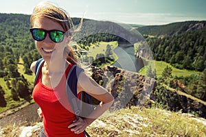 Woman hiker walks on the trail