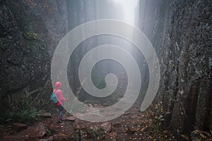 Woman hikes through Slättdalsskrevan canyon in Skuleskogen National Park in eastern Sweden