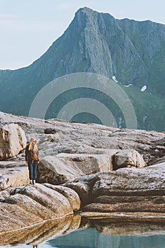 Woman hiking alone enjoying view outdoor in mountains travel solo